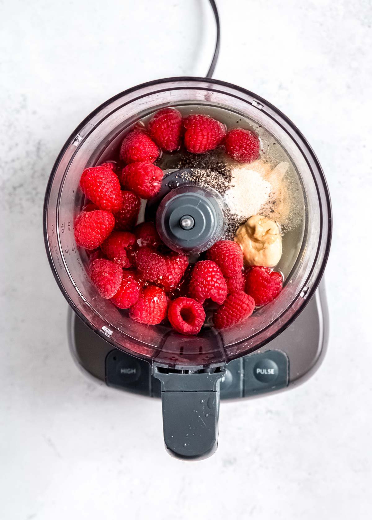 raspberry vinaigrette ingredients in a blender