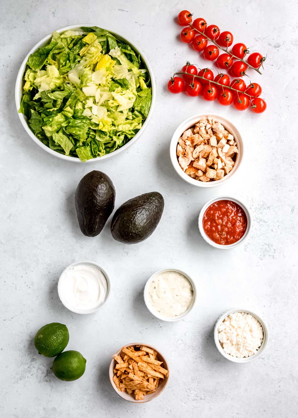 overhead image of southwest chicken salad ingredients on a white table