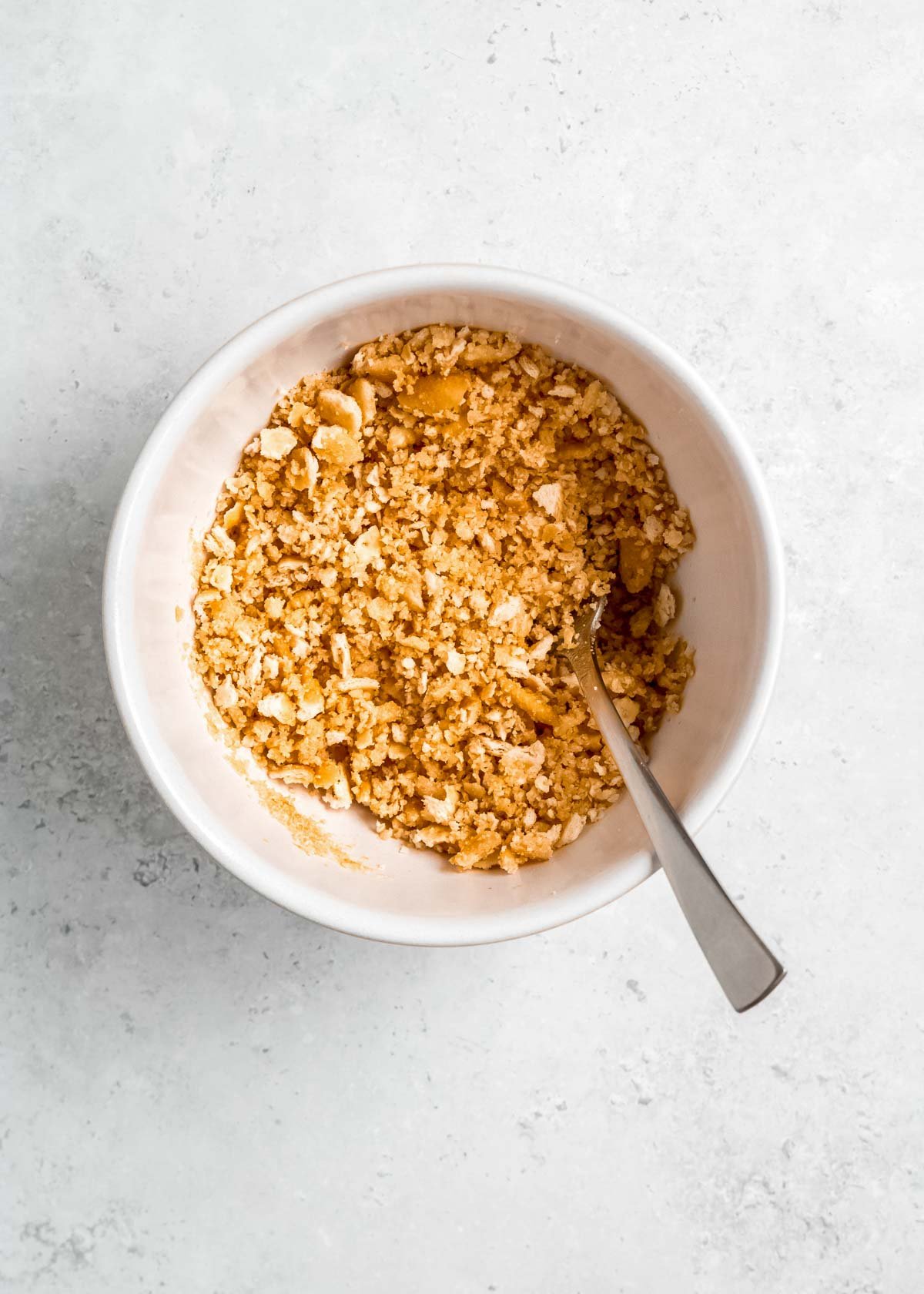 cracker crumbs in white mixing bowl