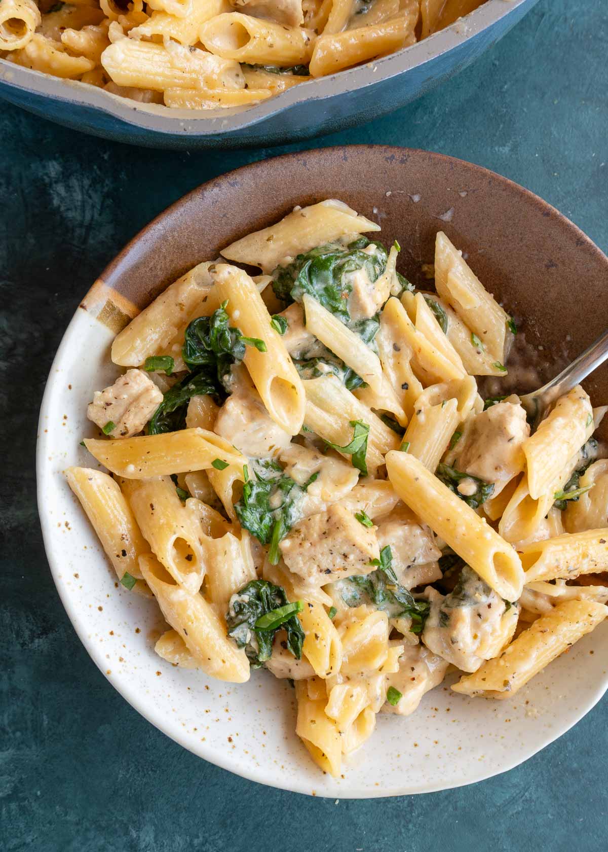 penne spinach pasta in bowl