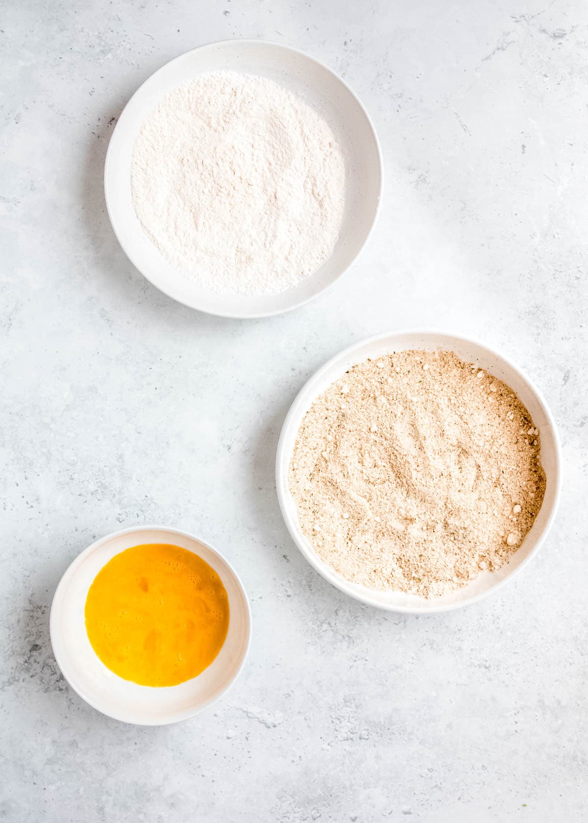 breading ingredients on a white table