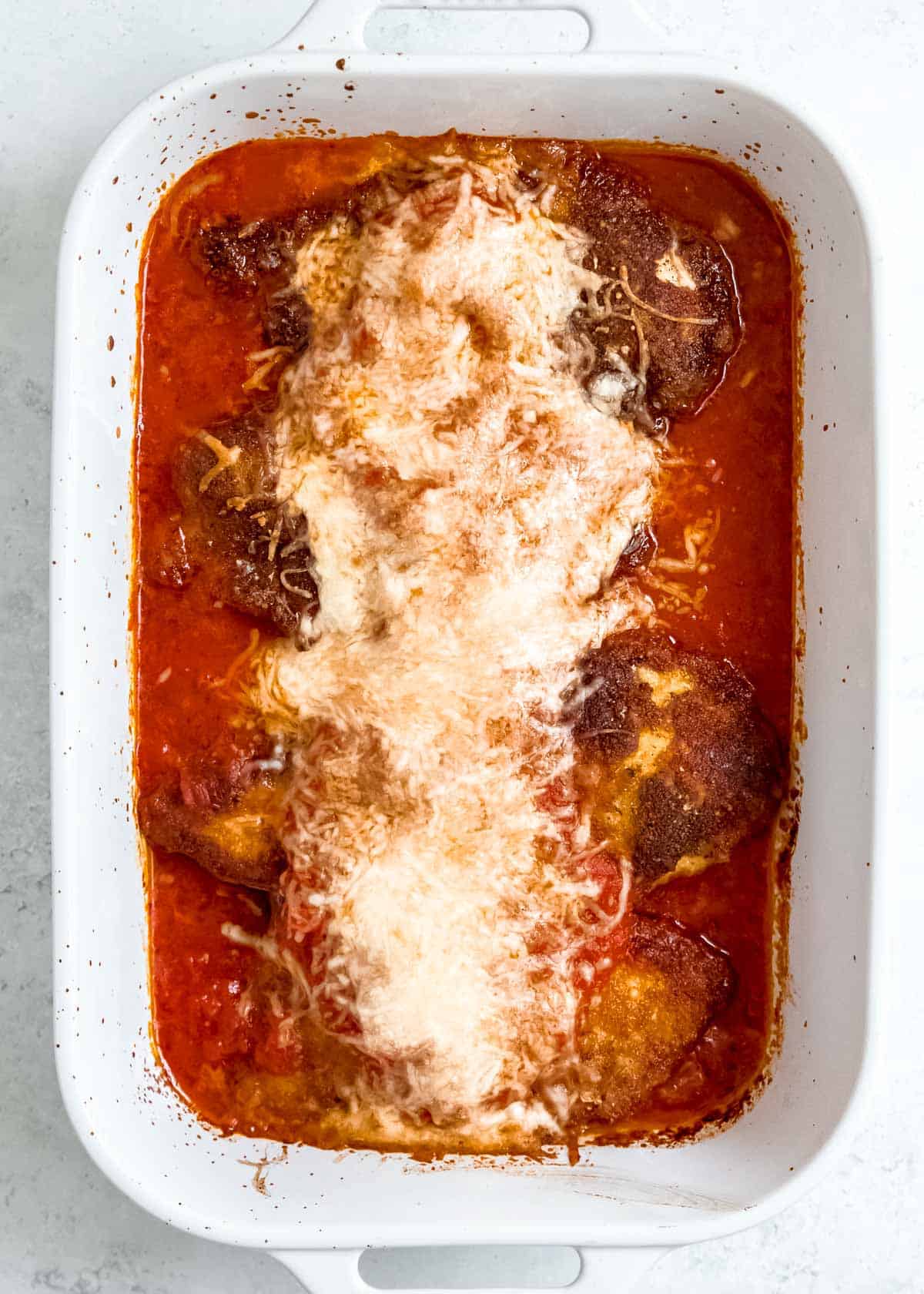 chicken parmesan in baking dish after being baked