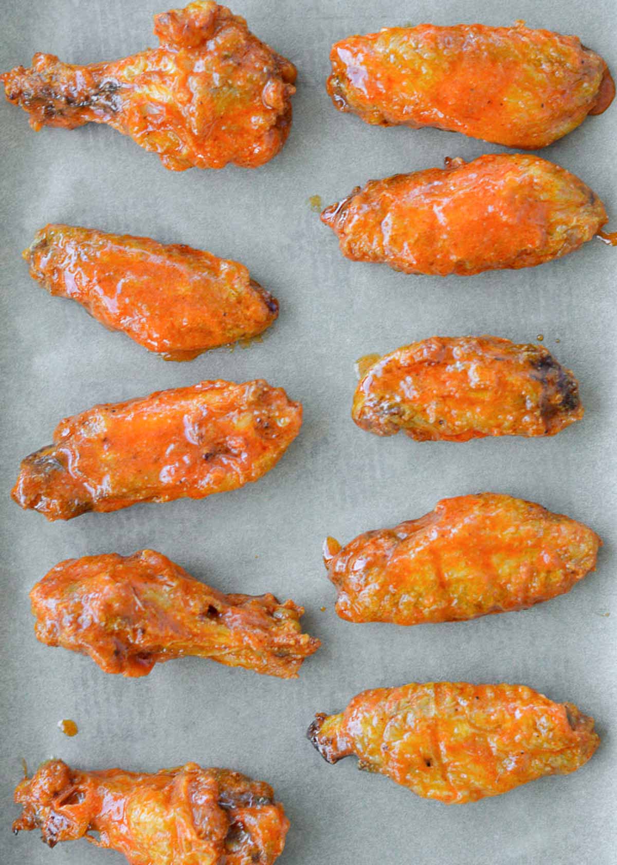 air fryer chicken wings coated in buffalo sauce