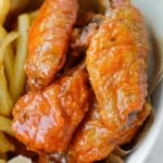 crispy buffalo chicken wings with a side of air fryer french fries