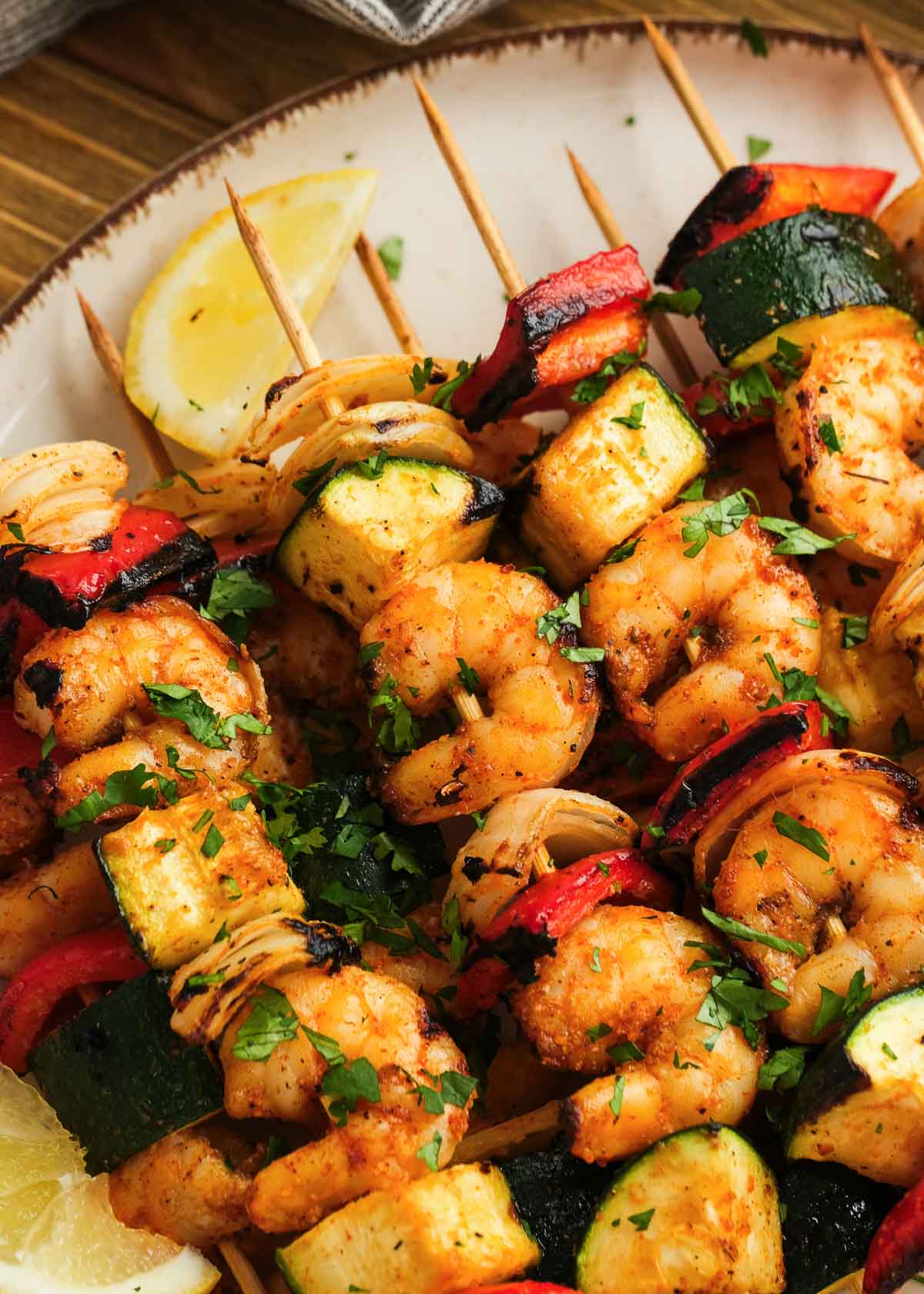 juicy grilled shrimp and vegetables assembled on skewers for easy summer meal