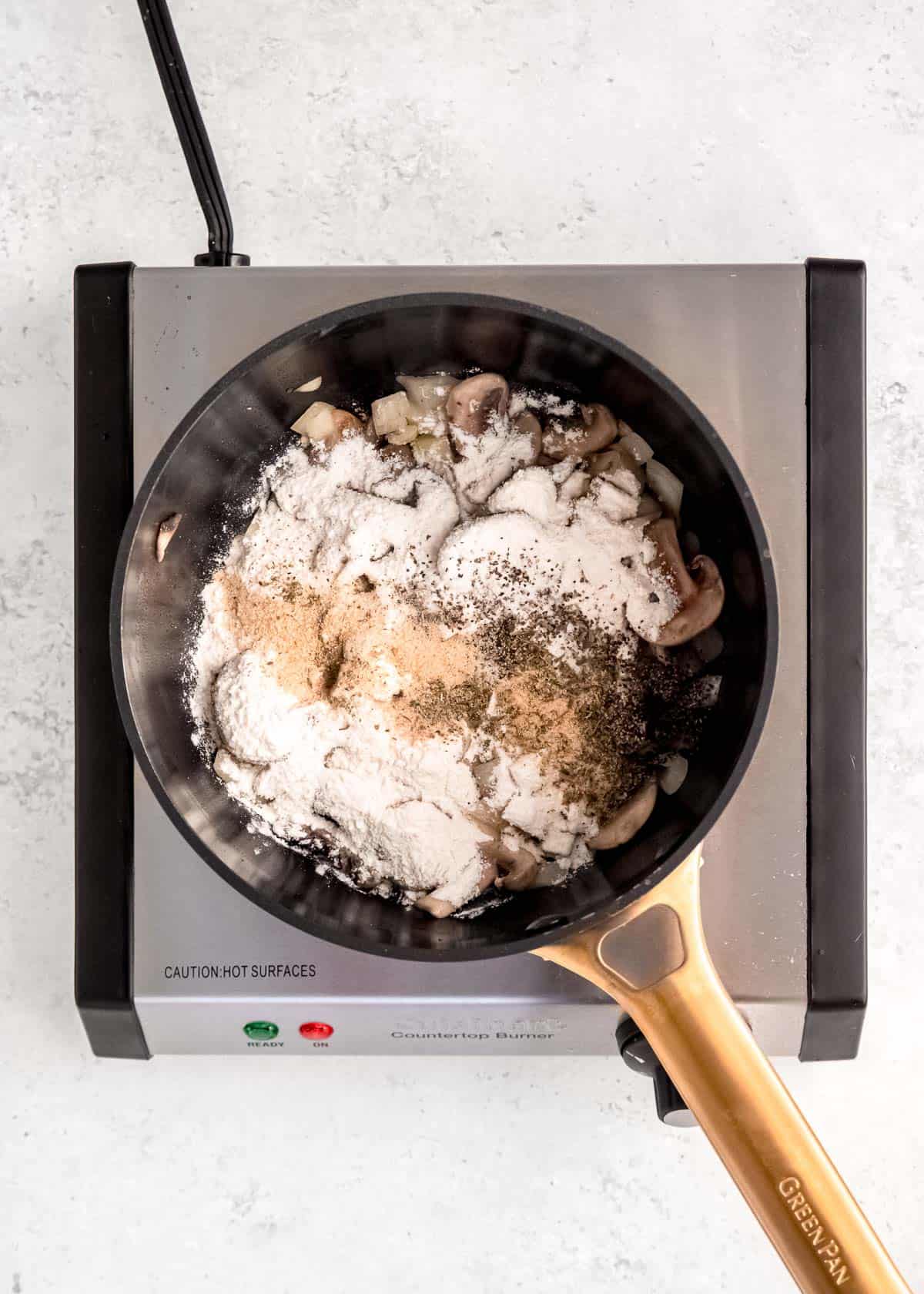 seasonings and flour added to sautéed mushrooms and onions