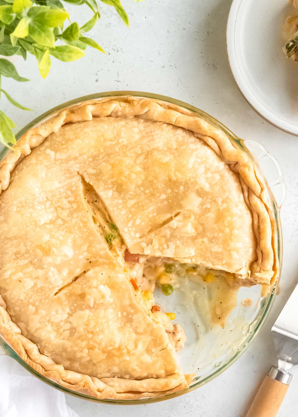 overhead image of baked pot pie with slice missing