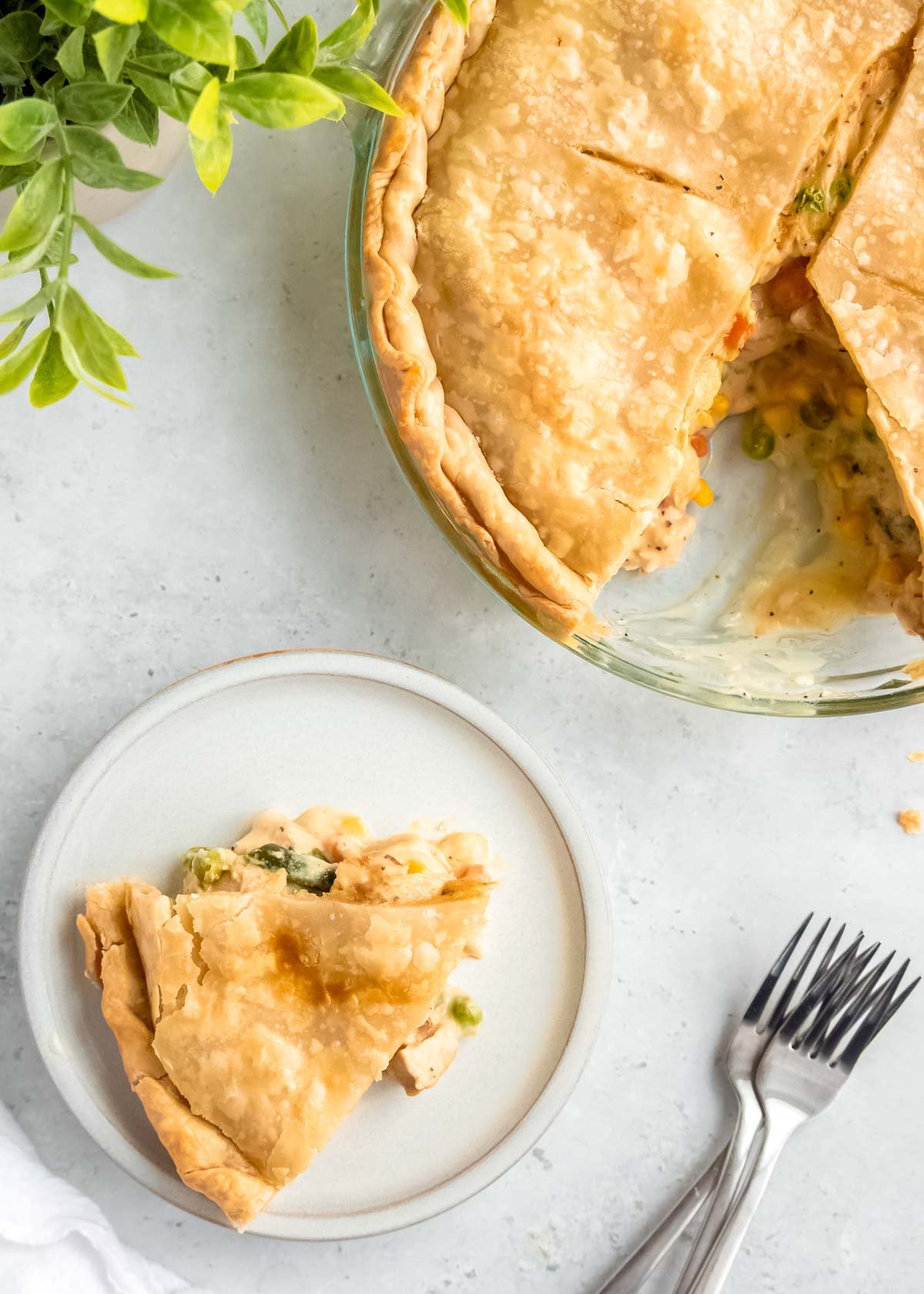 overhead image of chicken pot pie and slice of chicken pot pie on plate 