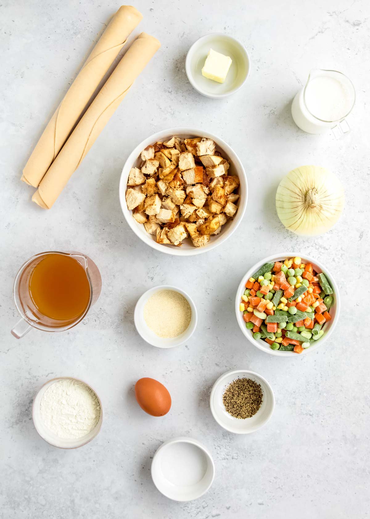 chicken pot pie ingredients on a white table