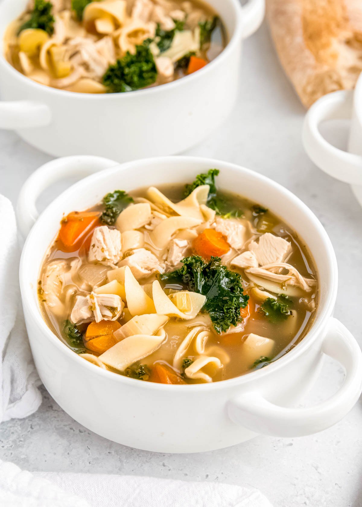 two bowls of homemade chicken noodle soup