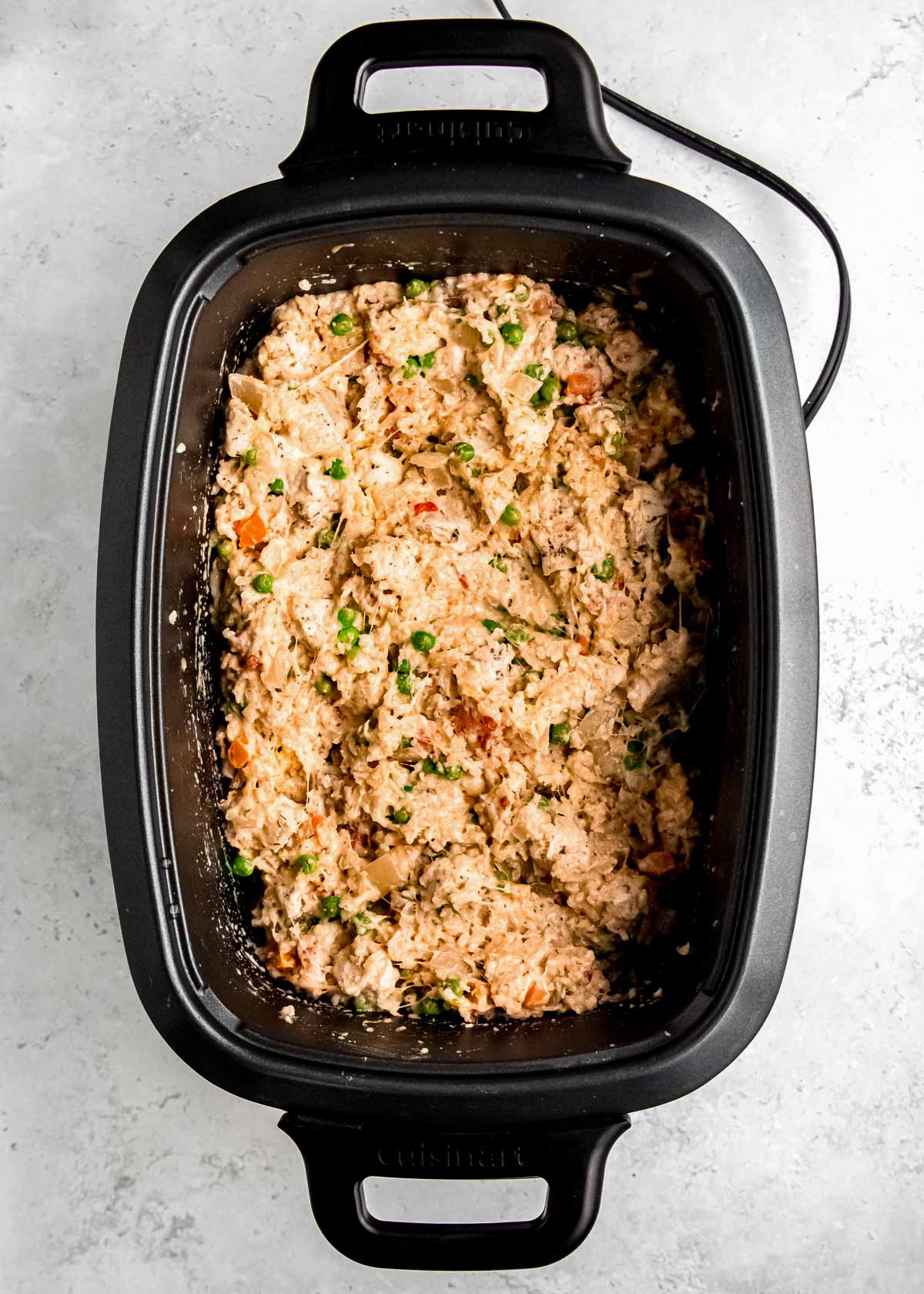 cheesy, creamy chicken and rice in a large crock pot