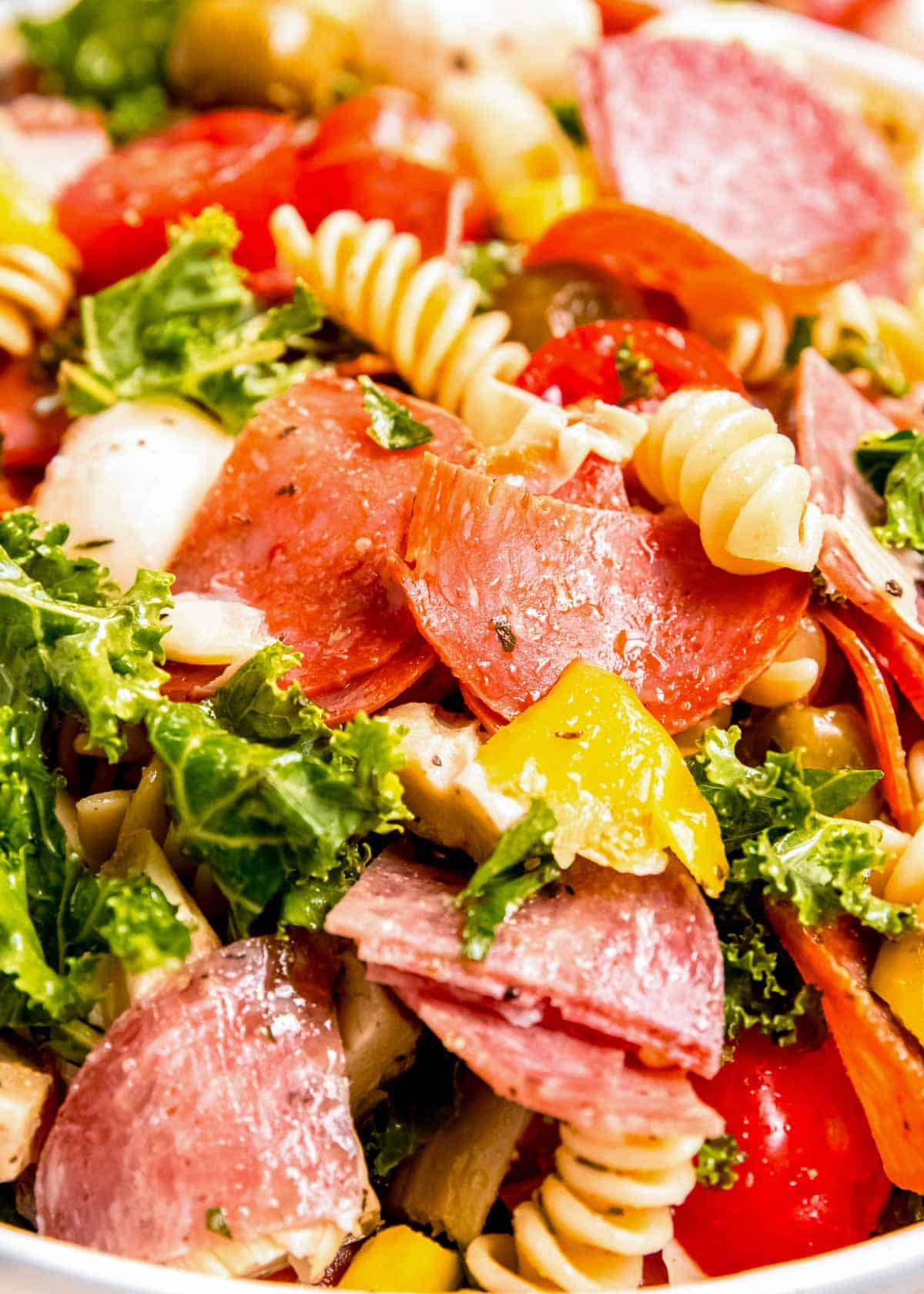 closeup showing the delicious italian vinaigrette over antipasto pasta salad