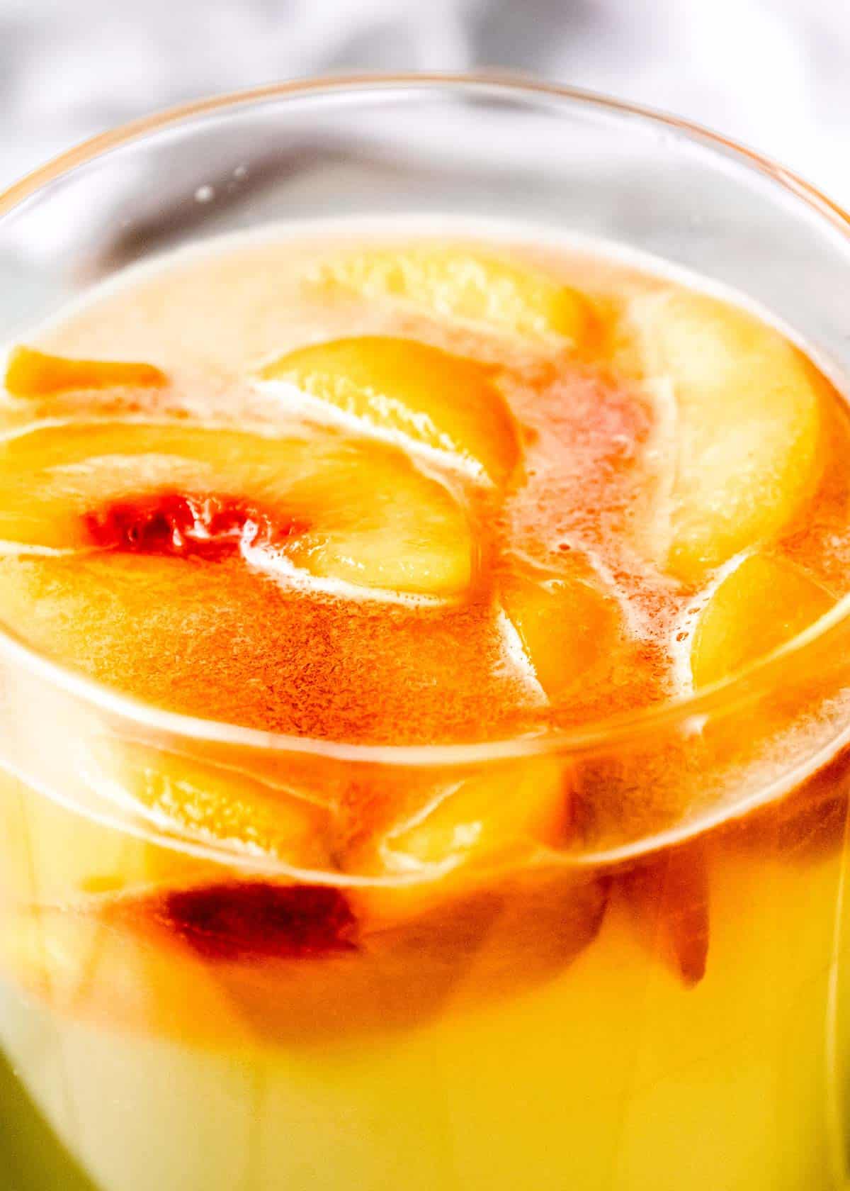 peach slices stirred into homemade lemonade