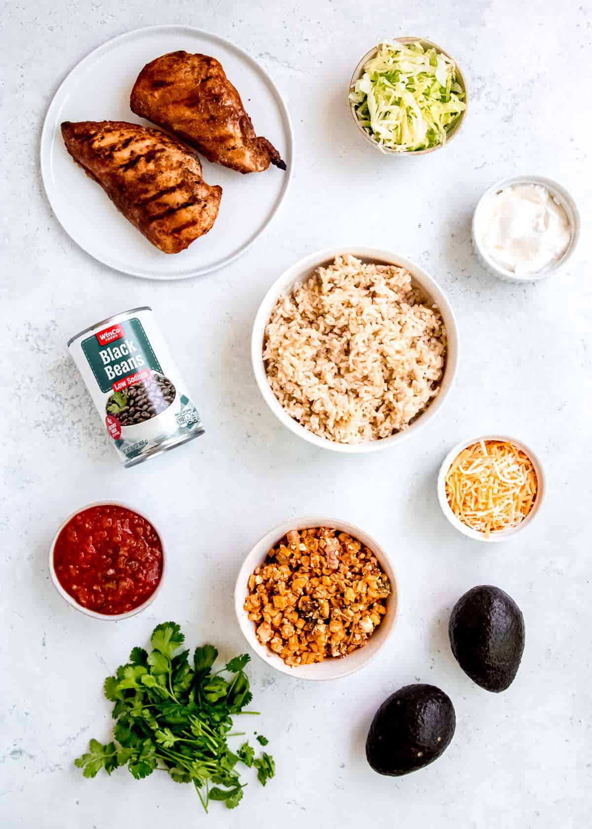 all ingredients needed for street corn burrito bowls on a countertop