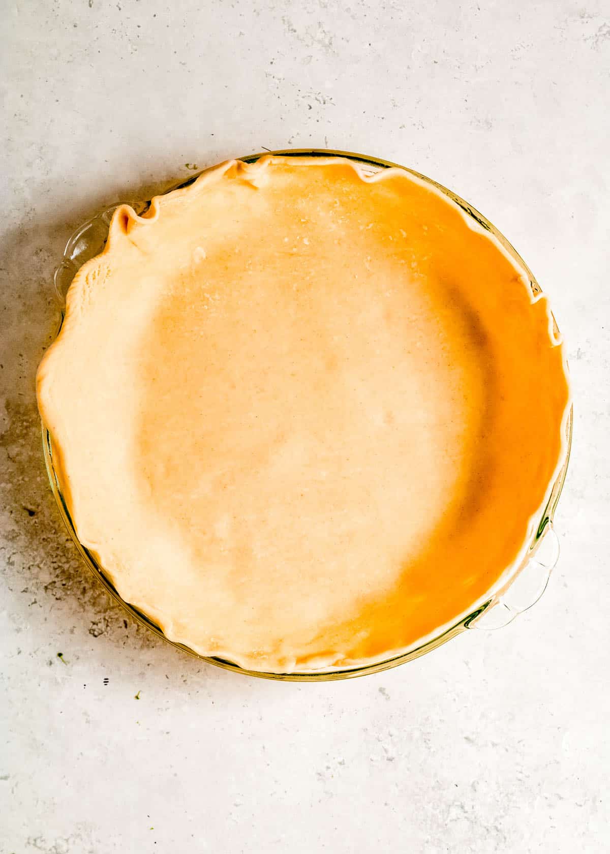 a refrigerated pie crust pressed into a deep pie pan