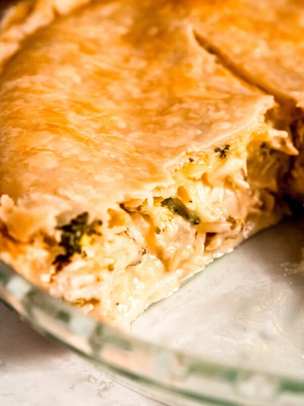 closeup shot showing the creamy broccoli cheddar chicken filling in the pot pie