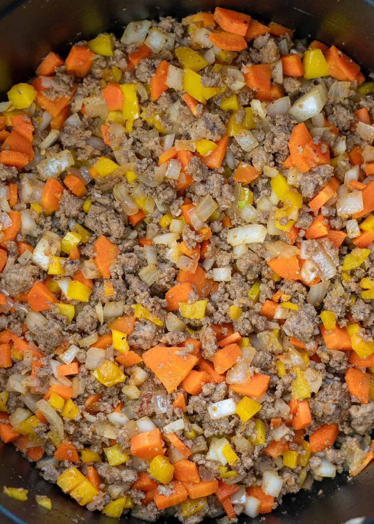cooked beef and veggies in a cast iron dutch oven