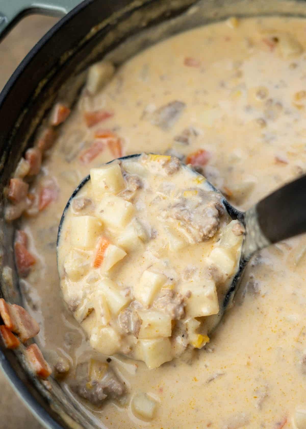creamy, cheesy hamburger potato soup after stirring to mix in the cream cheese and shredded cheese.