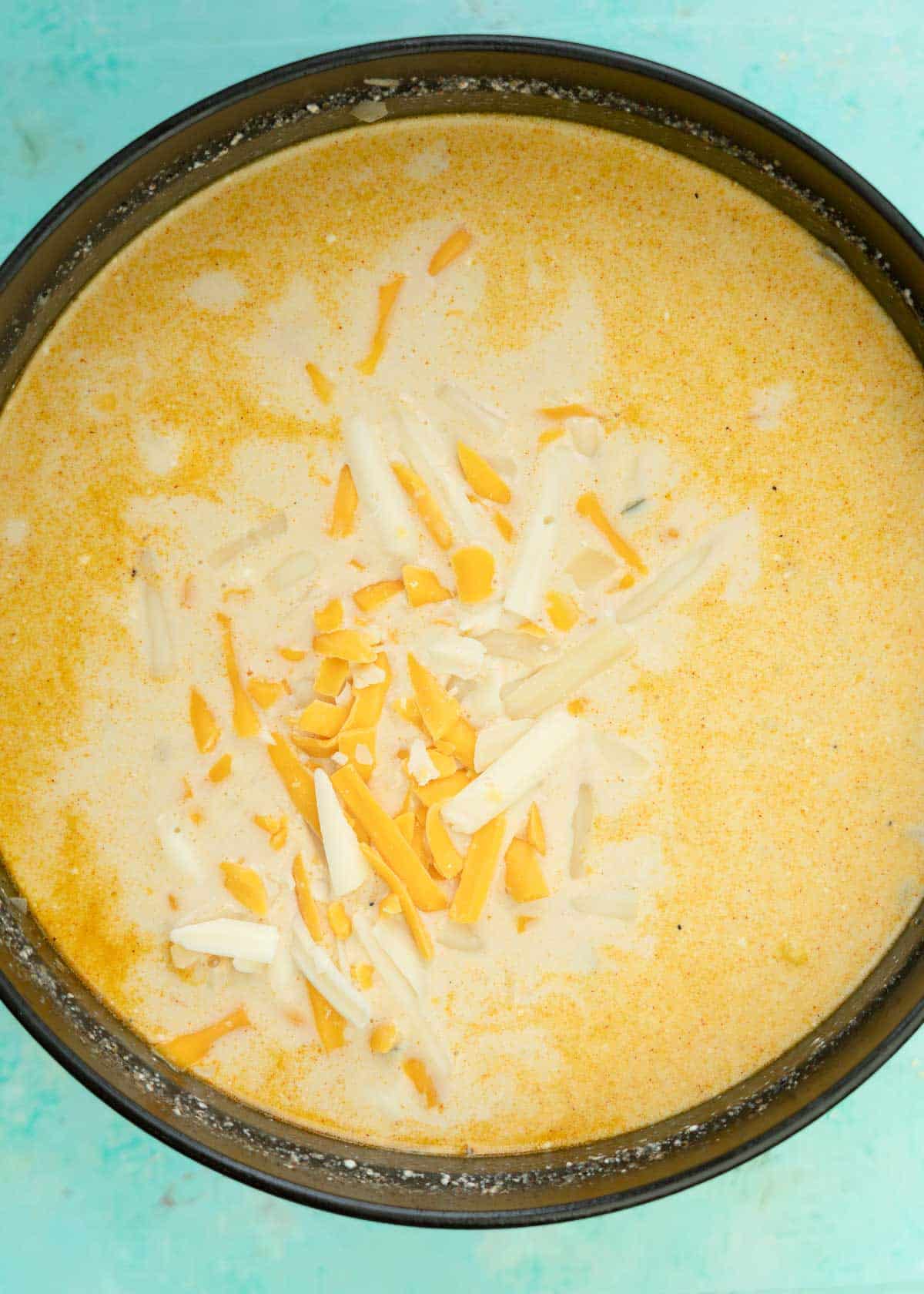 heavy cream and shredded cheese added to creamy mexican street corn soup