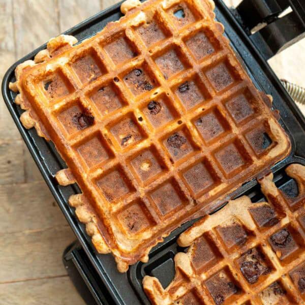 two square protein waffles in a waffle iron