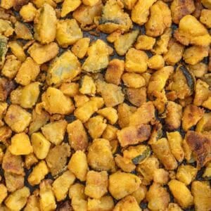 Crispy breaded zucchini and squash on a baking sheet
