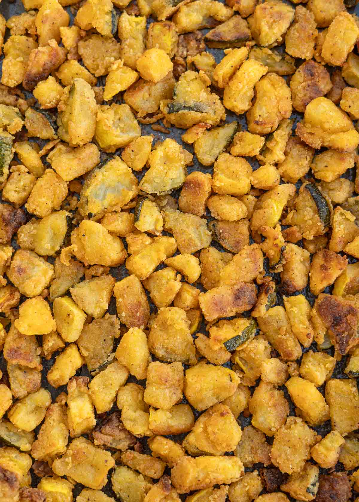 Crispy breaded zucchini and squash on a baking sheet