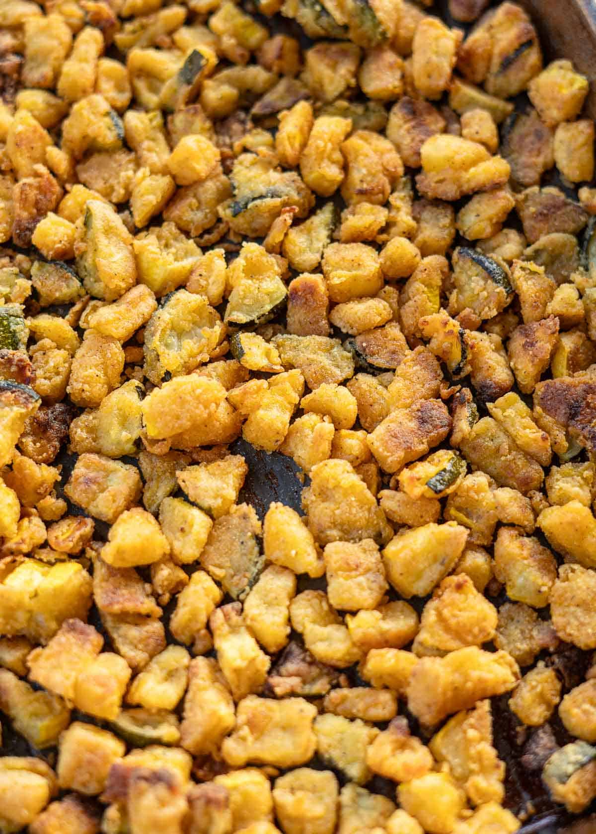 crispy breaded zucchini on a baking sheet