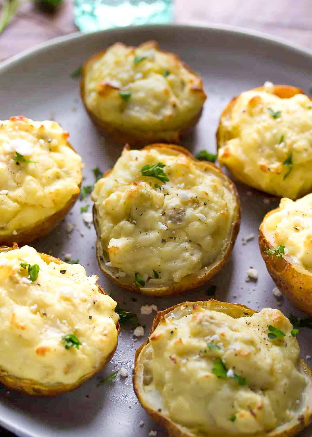 closeup of creamy twice baked potatoes with artichokes, feta, and eggs