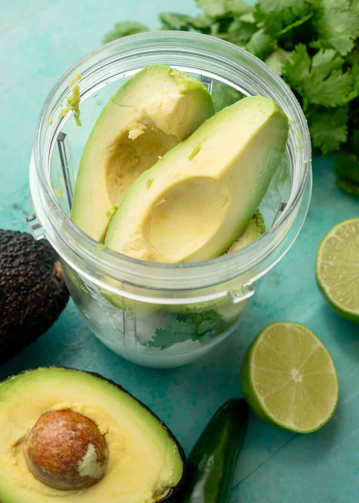 avocados, lime juice, lime zest, sour cream, cumin, and cilantro in a blender cup