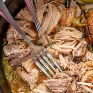 Juicy pork sirloin roast shredded in a pot