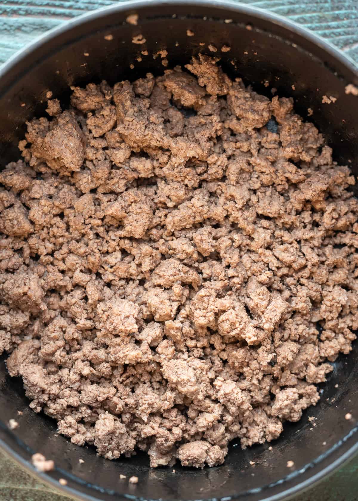 browned beef in a black dutch oven