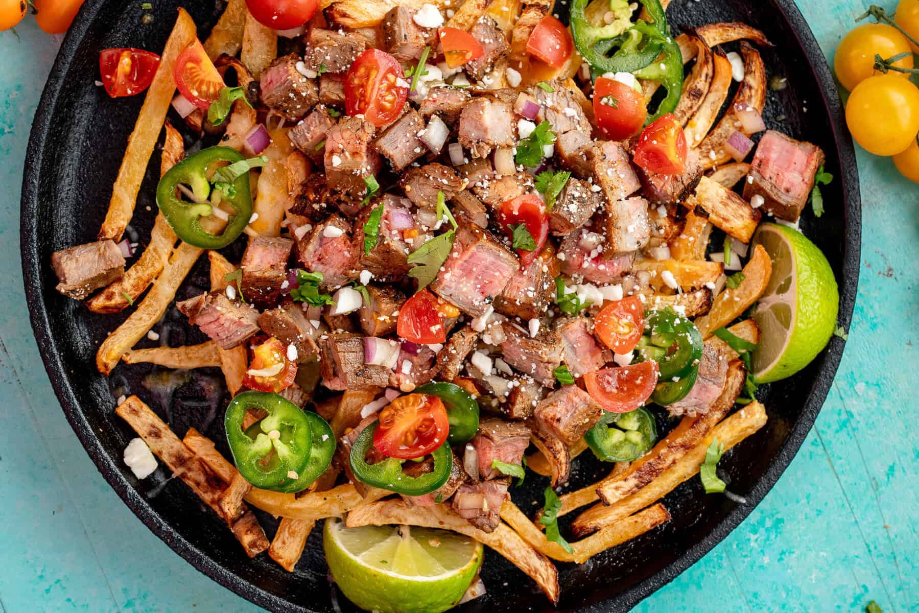 keto rutabaga fries covered in juicy carne asada