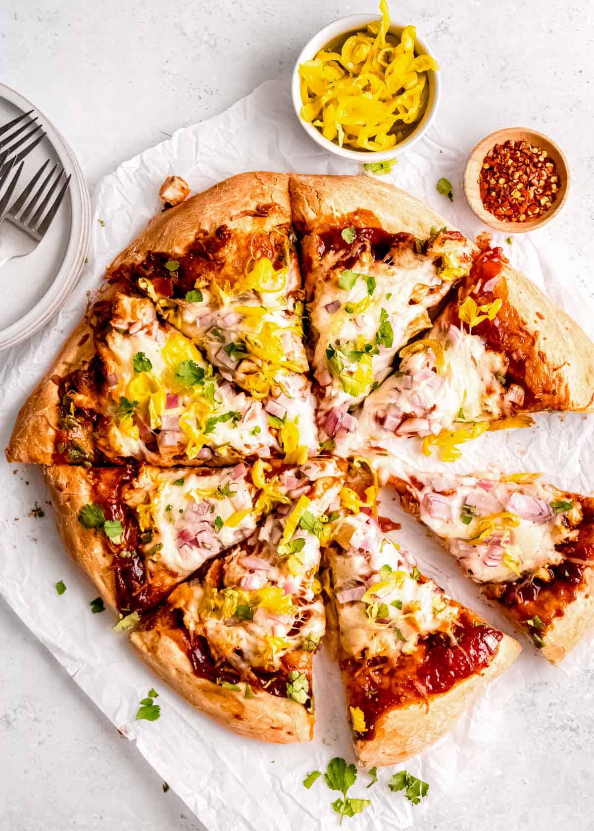overhead shot of tangy bbq chicken pizza cut into 8 slices