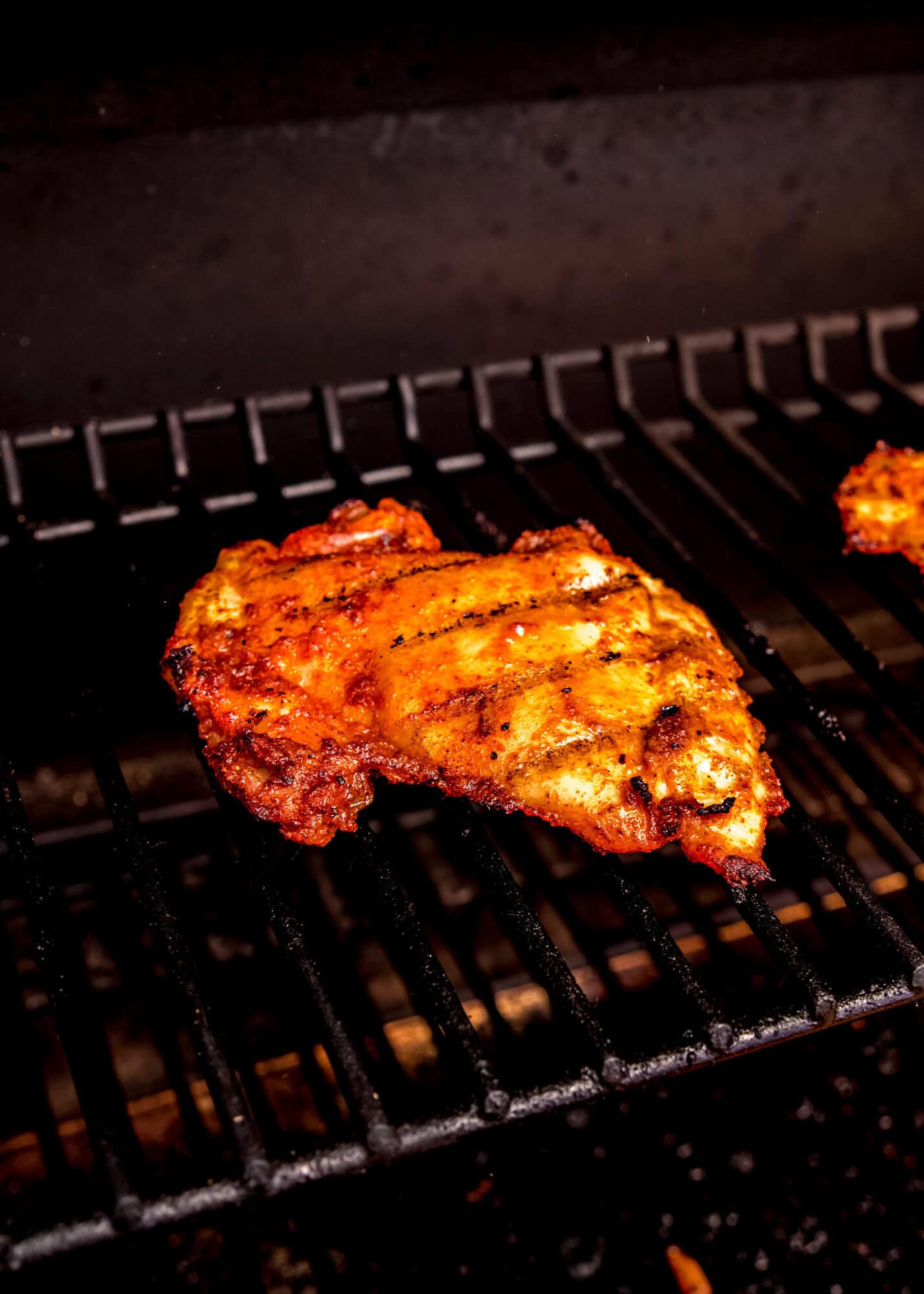 marinated chicken thighs on the grill