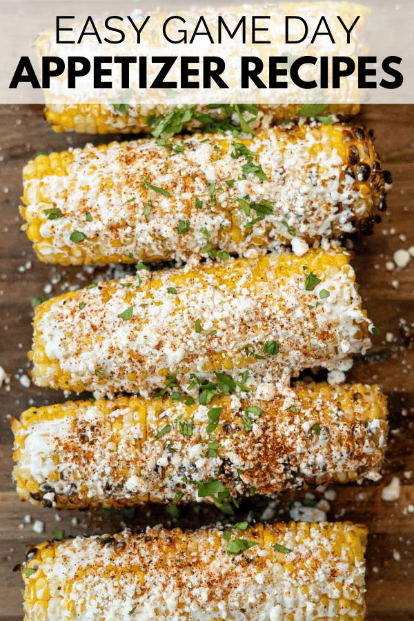 image shows grilled mexican street corn on a cutting board. Text overlay: EASY GAME DAY APPETIZER RECIPES